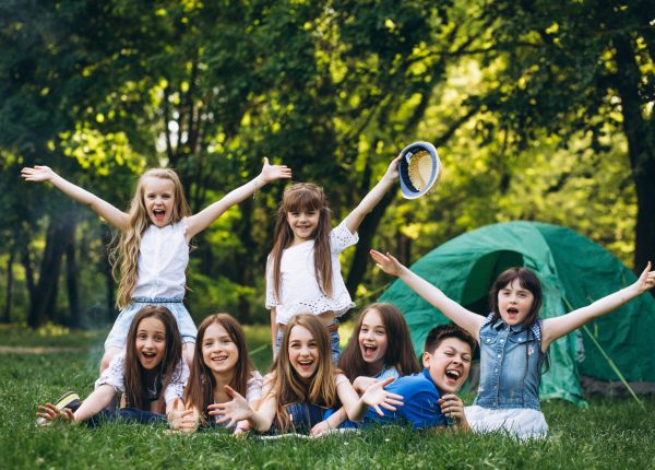 Group of girls camping in forest